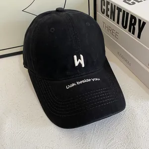 Classic black cotton baseball cap with white H embroidery and walk beside you text
