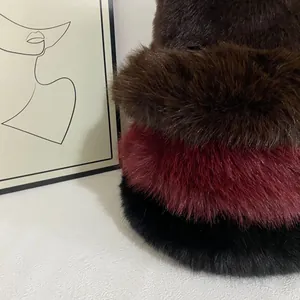 Faux fur winter bucket hats in dark brown, burgundy, and black with plush texture