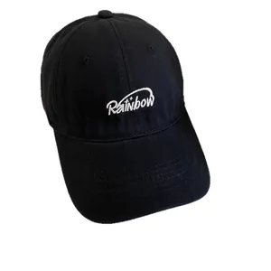 Classic black cotton baseball cap with white Rainbow embroidery and wide brim