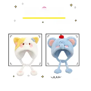 Detail of plush cartoon cat and elephant earflap hats with cute 3D charms and soft lining