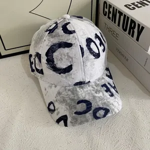 Distressed vintage baseball cap with navy blue letters and washed denim canvas texture