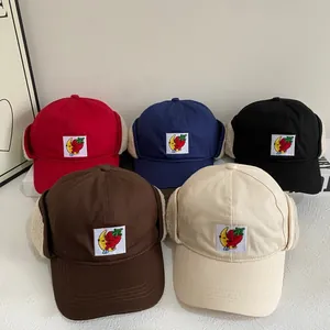Winter fleece-lined earflap baseball caps in five colors with cute cartoon embroidery