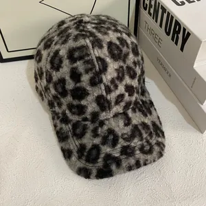 Detail showing the thick plush texture and grey leopard print of this baseball cap