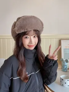 Close-up of brown faux fur trapper hat with ear flaps for winter warmth and protection