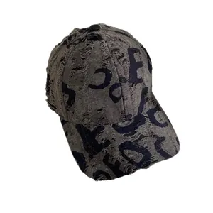 Distressed dark gray denim baseball cap with vintage letter prints and ripped details