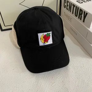 Winter thermal baseball cap with ear flaps and strawberry banana embroidery on black cotton