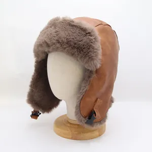 Detail of brown trapper hat with faux fur lining and chin strap on a mannequin head