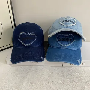 Three vintage denim baseball caps with heart embroidery and distressed brim details