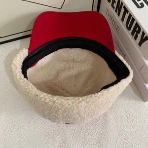 Macro detail of winter baseball cap with plush fleece lining and red brim texture