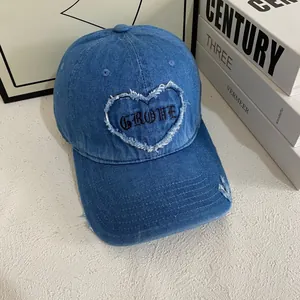 Deep blue denim baseball cap with heart embroidery and vintage distressed details