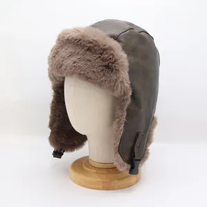 Detail of vintage brown faux leather aviator hat with plush faux fur lining and buckle