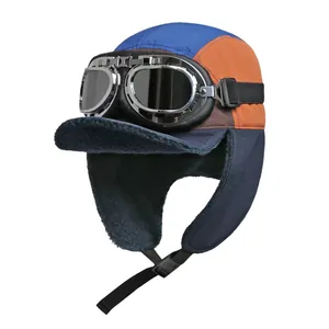 Close-up of color-block pilot hat with thick fleece lining and vintage goggles details
