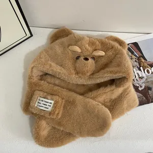 Detail of soft brown plush 3-in-1 hat scarf set with cute bear ears and textile label