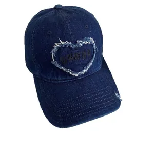 Dark blue denim baseball cap with heart embroidery and distressed vintage street style details