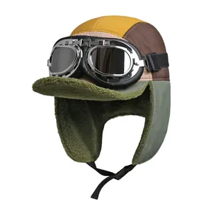 Retro multi-color aviator trapper hat with green fleece lining and vintage goggles