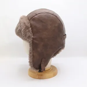 Side view of brown faux leather trapper hat with thick plush fur lining on a head model