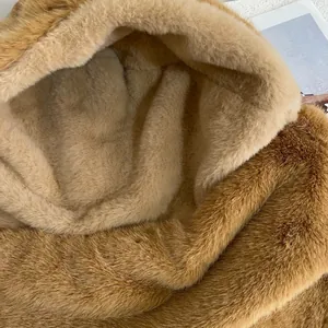 Detail of plush brown faux fur texture and warm hood lining for winter hats