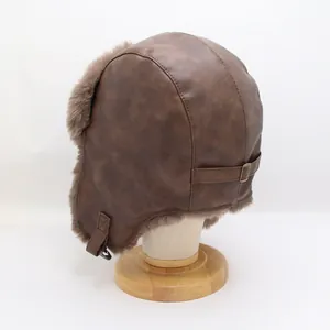 Detail of brown faux leather trapper hat with fur lining and adjustable back metal buckle strap