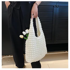 Detail of white bubble texture tote bag with premium pleated 3D fabric design