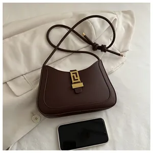 Macro view showing deep coffee leather bag interior capacity with a smartphone