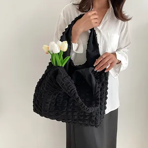 Fashionable black popcorn fabric shoulder tote bag with unique textured puff design