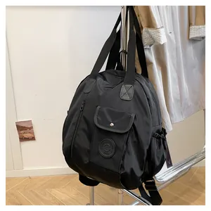 Detail of black large capacity nylon travel backpack with multi-pocket functional design