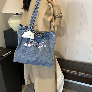 Retro denim tote bag in washed blue with embroidery and plush cloud pendant charm