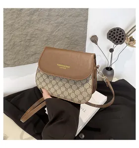 Detail shot of the vintage leather shoulder bag featuring a stylish contrast check pattern
