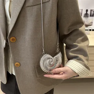 Chic silver conch shell mini chain bag with metallic texture for cross-body styling