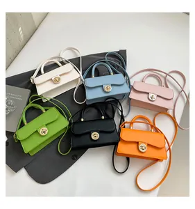 Flat lay of elegant square handbags in six colors with metal locks and adjustable straps