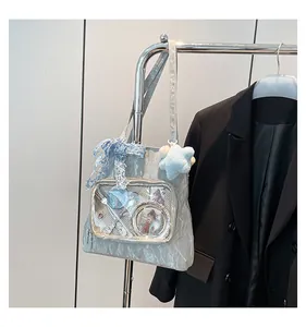 Macro shot of silver metallic ita bag with transparent window for display charms