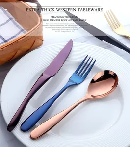 Detailed view of titanium-plated stainless steel cutlery in vibrant metallic finishes