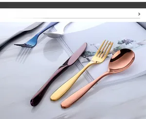 Mirror-polished 304 stainless steel cutlery set in multiple metallic colors on marble surface