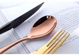 Macro shot of 304 stainless steel cutlery set with mirror finish in gold and black