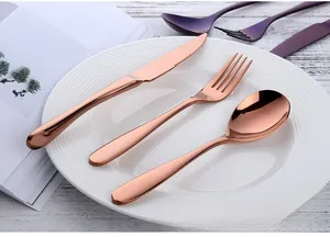 Detail of rose gold mirror finish stainless steel steak knife, fork and spoon set