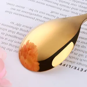 Polished gold stainless steel dinner spoon with mirror finish and elegant design