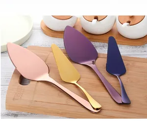Detail of 304 stainless steel cake servers in rose gold, gold, purple, and blue finishes