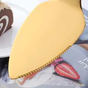 Golden stainless steel lotus cake server with serrated edge and mirror finish