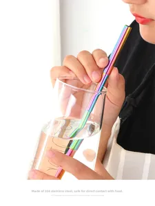 Detail of colorful 304 stainless steel bent straw in glass cup with high-gloss finish