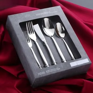 Macro detail of a 20-piece 18/10 stainless steel cutlery set in premium gift box packing