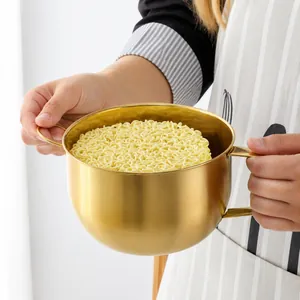 Golden double-handled stainless steel bowl for noodles with a brushed metallic finish