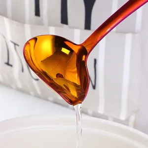 Polished stainless steel ladle with pour spout for sauce and oil in gold finish