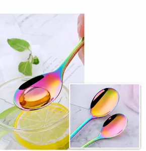 Macro view of polished rainbow stainless steel spoon with smooth edges and mirror finish