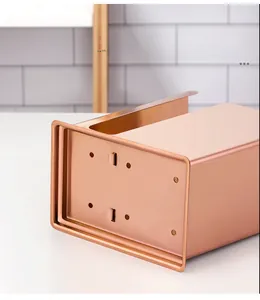 Detail of rose gold stainless steel holder with circular drain holes for water drainage