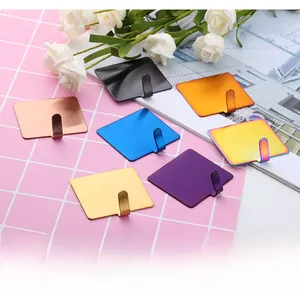 Collection of colorful stainless steel adhesive hooks shown in diverse metallic finishes