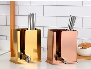 Detail of dual-compartment stainless steel utensil holder in gold and rose gold finish