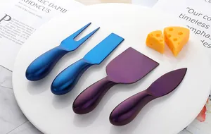 Macro shot of a four-piece stainless steel cheese knife set in matte blue finish