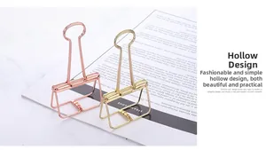 Detail shot of hollow metal binder clips in elegant gold and rose gold finishes