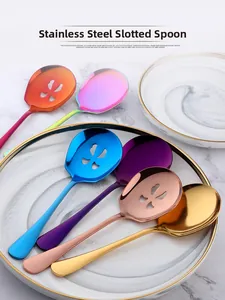Close-up of colorful stainless steel serving spoons with elegant petal-shaped drain holes