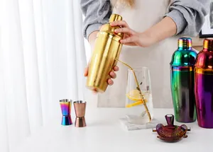 Polished stainless steel cocktail shaker set with jiggers and strainer in gold finish